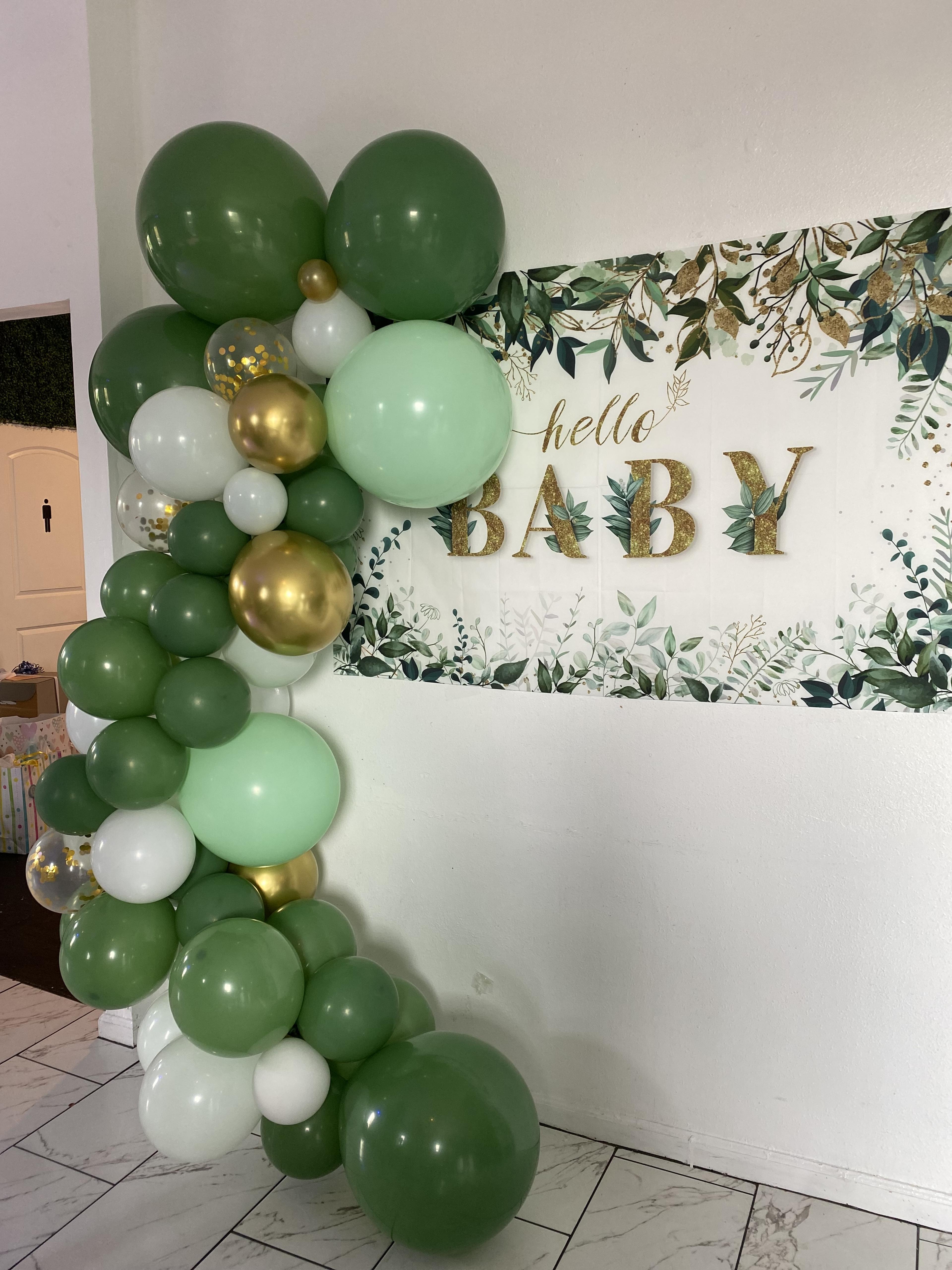 Gold, green and white balloon arch for baby shower 