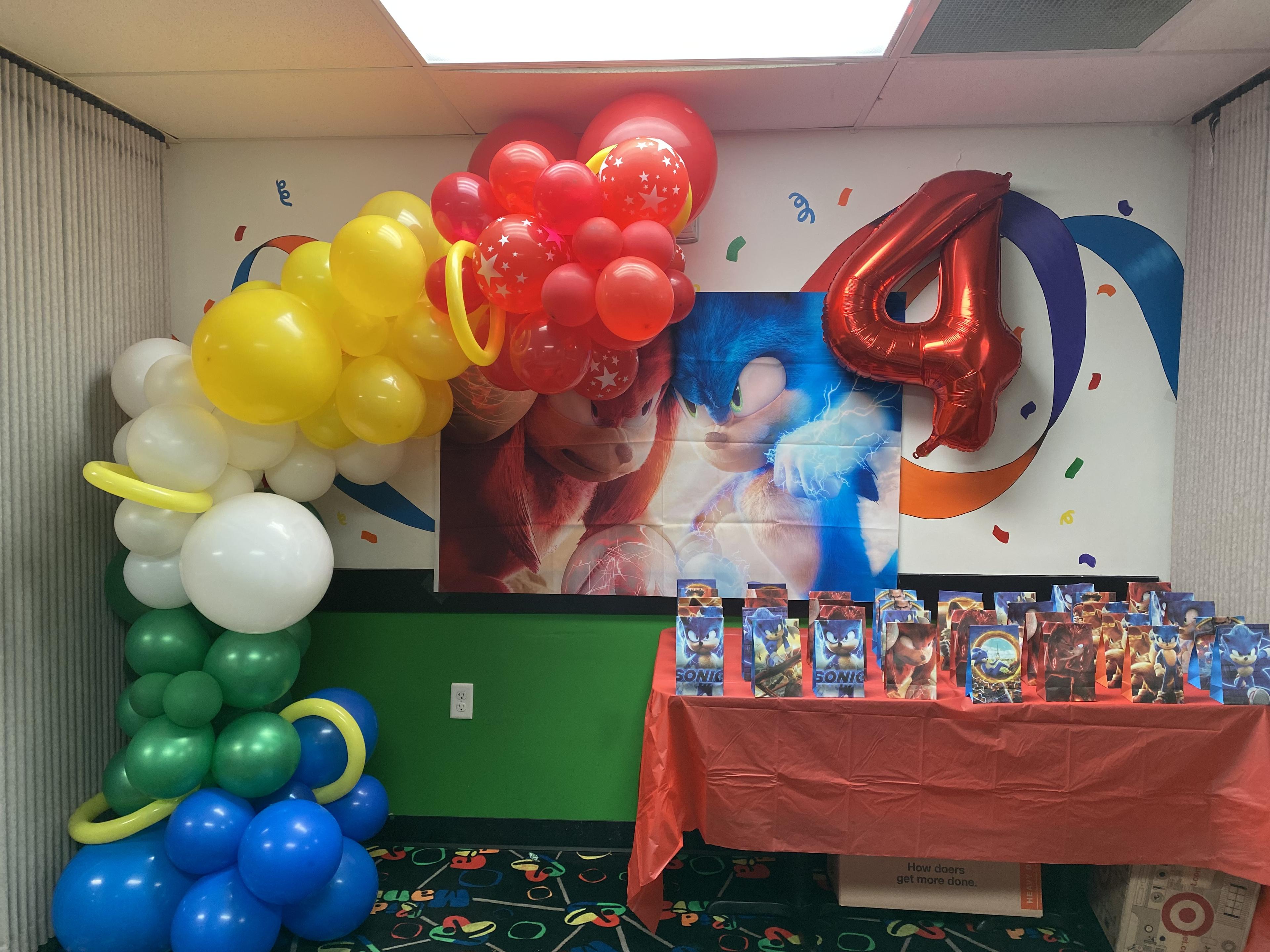 Knuckles & Sonic birthday party with themed balloon arch, multi-colored