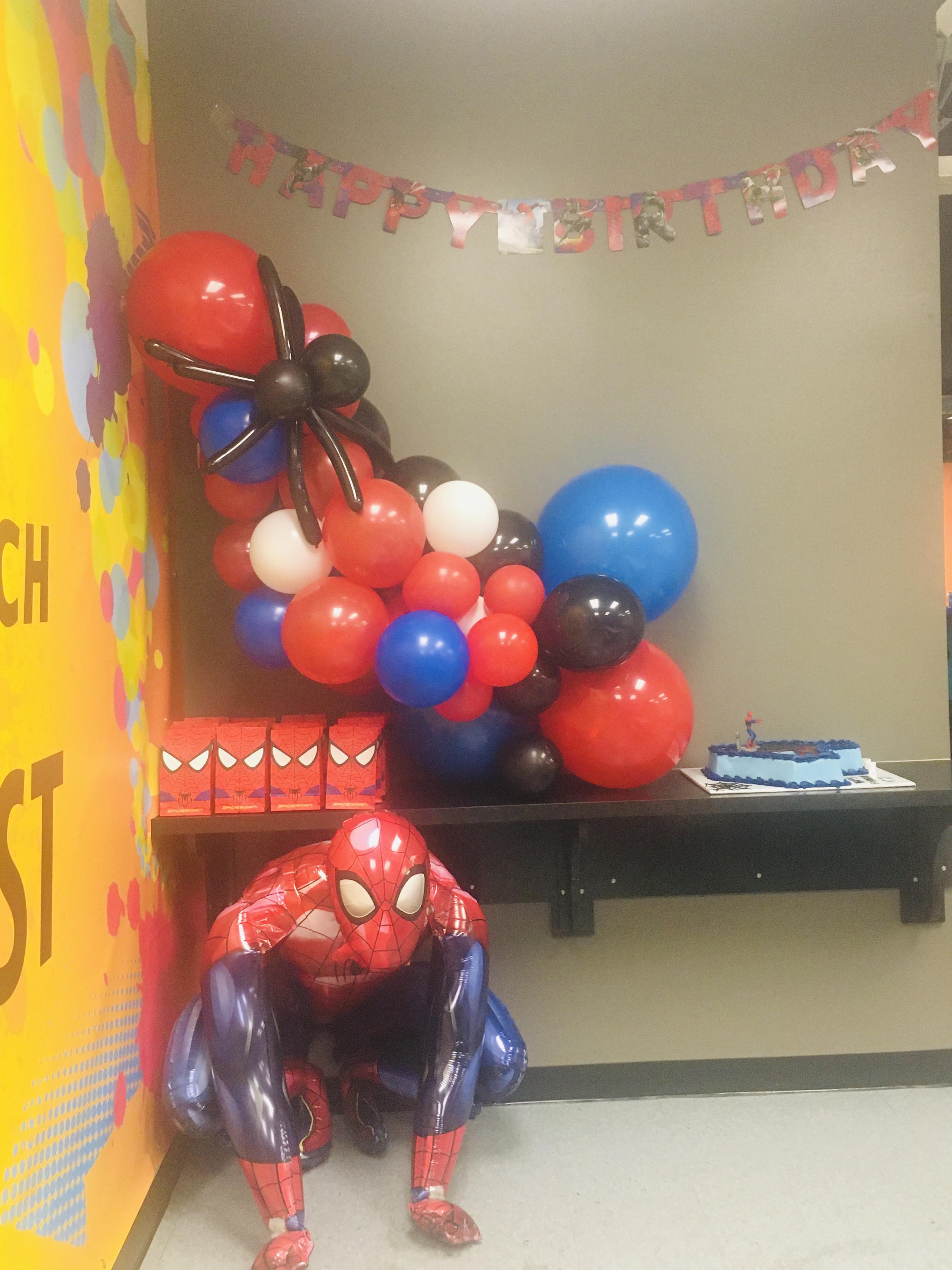 Spider-man themed balloon arch at birthday party